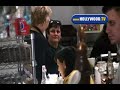 katie holmes has a very attentive lunch date with a mystery date at joan's restaurant ... without her hubby tom cruise! amazing!