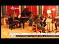 Condoleezza Rice performs on the piano at Buckingham Palace for Queen Elizabeth II