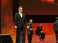 Drew Carey and IBM executive Robert Leblanc play...