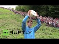 UK: Daredevils launch themselves downhill in cheese rolling race UK: Daredevils launch themselves downhill in cheese rolling race