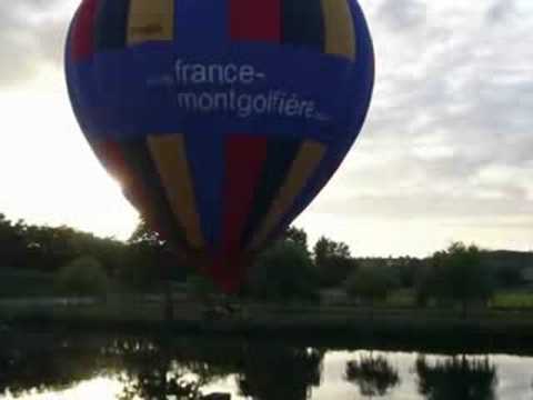 Hot air balloon close over river Cher