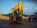 driving with new Komatsu WB 97 S backhoe to work