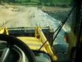 driving with new Komatsu WB 97 S backhoe to work
