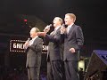 this video contains photos and videos from thursday afternoon and evening.  it features the dixie echoes, mark trammell trio, booth brothers, gold city, triumphant, dove brothers, kingdom heirs, belle and taranda greene, and greater vision.