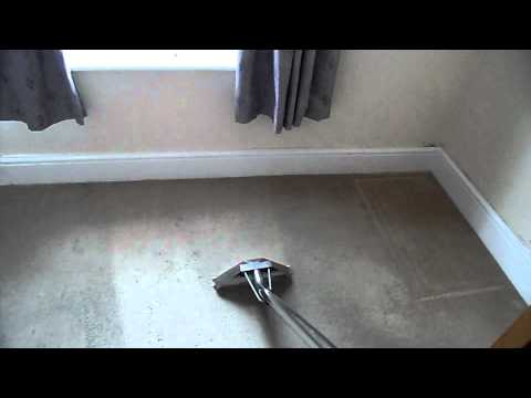 Cleaning a bedroom carpet with a truckmount