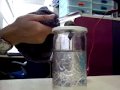 This Leyden jar is made from a plastic container. 1. I wrapped aluminium foil around the outside of the plastic container starting from one-third down the top. 2. A brass pendulum bob is placed over the cap and a chain of paper clips dangle from the bob under the cap. 3. Filling it with saltwater, the container is capped with the paper clips submerged in the saltwater. 4. Make sure that the aluminium foil outside the jar is grounded. This can be done by holding the jar with a hand. What I ...