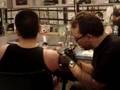Dick Talens being tattooed