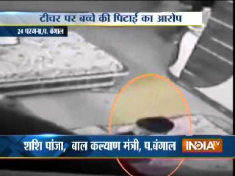 teacher - 3-year-old kid mercilessly beaten by tution teacher, caught on CCTV For more content go to http://www.indiatvnews.com/video/ Follow us on facebook at https://www.facebook.com/indiatvnews...