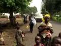 Near Goma, Congo, soldiers and rebels loot a refugee camp