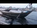 sadarghat boatman cuts through buriganga