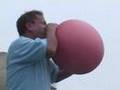 Franco Columbo blows Hot Water Bottle like a Balloon July 07