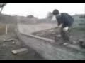 An Apprentice Bricklayer Diving into a Tub of Cement