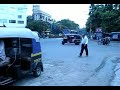This video was shot on my first day outside of North America.. this was the intersection right outside of the Central Market in Pune.

One of the things that really captivated me in India was how insane the traffic was, and how the lines on the road, the signs, and the traffic signals were merely "suggestions" rather than something to be followed.

You'll note that in the video the traffic light turns red, but cars and auto-rickshaws just go blasting right through it. - Traffic in Pune, Maharashtra, India