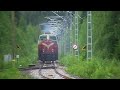 Three light running locomotives pass Suhonen level crossing