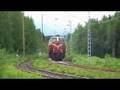 Three light running locomotives pass Suhonen level crossing