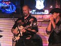 Midnight Shuffle Kings performing at Odie's House of Blues, Hot Springs, AR, June 26, 2009. Danny Smith on guitar, Scott Arivatt on keybboard, Greg Batterson on harmonica, Rooster Meeks on bass, Brian George on drums.