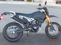 A QLINK XF200 SUMO w/ BLACK REFLECT WHITE NUMBERS