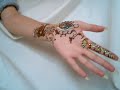 Unique Mendi creation using glitter and jewels. Unique Mendi creation using glitter and jewels.