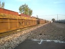 BNSF #4100 leads N/B bartables that race through Merced,CA