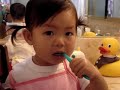 Kung Fu baby brushing her teeth