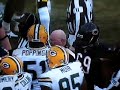 Umpire Jim Quirk takes down Packer Nick Barnett
