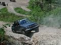 Tracker climbing a hill in Superlift OHV
