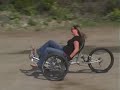 The Berserker Tricycle embodies a radical new design in recumbent tricycles, utilizing a long travel suspension system to increase its off-road effectiveness. The Berserker Tricycle is the first of its kind to be specifically designed for off-road use—it is engineered to withstand the added stress and abuse from rugged terrain. The Berserker Tricycle offers a unique off-road cycling experience for all riders, but especially for people with back problems or related injuries that make traditional cycling uncomfortable. The recumbent design of the Berserker Tricycle repositions the rider. This allows for a more natural seated position, which tends to be more comfortable for riders when compared to a traditional bicycle.