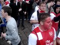 Arsenal fans sing in milan square