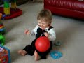Stevenjr wiggles toes with red balloon
