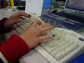 A girl is typing with long nail fingers.