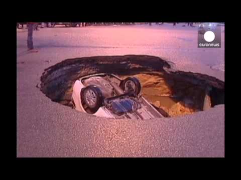Sinkhole swallows car: lucky escape, China