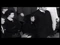 jacqueline kennedy awaits the arrival and carrying of president kennedy's coffin into the capital- and into the capital rotunda on november 24, 1963. with her is the attorney general robert kennedy (brother of president kennedy), and the children of president kennedy and jacqueline kennedy- caroline and john kennedy jr. also in the clip are president lyndon johnson and his wife lady bird johnson, as well as steve smith and his wife jean smith (the sister of president kennedy).