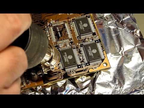 desoldering - Part of a typical SMT rework situation: Destruction free desoldering of an SMD from an old PC mainboard... I used this one a long time ;)