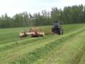Cutting with a valtra t-180 and a new holand 1475 haybine