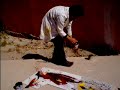 Maroccan painter Abdellah Amennou \"in action\"