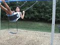 Lily jumps from swing