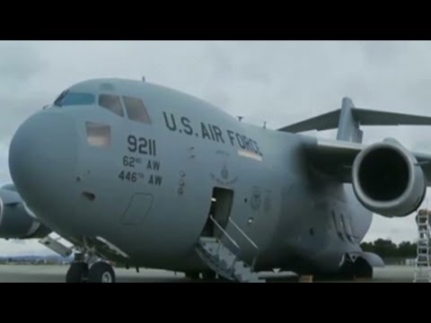 Body of 'apparent stowaway' found in U.S. Air F...