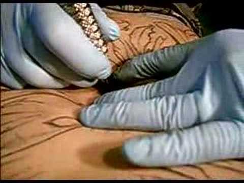 Rytch (Sith Tattoo) doing a belly button tattoo. Ouch!