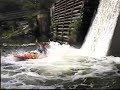 kevin benson kayaking down the waterfall, diving backwards off the cliff, wrestling an alligator in a pond.