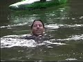kevin benson kayaking down the waterfall, diving backwards off the cliff, wrestling an alligator in a pond.