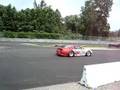 Number 45 Flying Lizard driving into pit lane