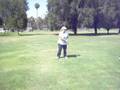 Sis takes a practice swing