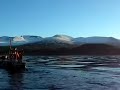 Springer towboat tows camera barge on choppy water.