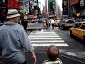 Elias walks through the paparazzis at Times Square