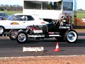 hambster on the 1/8 mile track  9.42 sec pass side view, up against a tonana