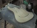 Part five of a video diary showcasing the construction of a custom made guitar. This video details cutting the neck joint, carving the top of the body, and the belly carve on the back. Stay tuned for more video diaries in the future. Subscribe for updates. Soundtrack by UTI (So Cold, Ive Tried) www.myspace.com/utimetal www.uti.com.au www.ormsbyguitars.com