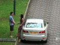 Woman Beats Man in Singapore
