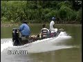 Embera men on a piragua going up the Sambu