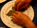 My Mom making Sarma (stuffed grape leaves)