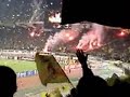 The Champions' League 2006-07 game between AEK Athens FC and AC Milan in Athens Olympic Stadium. AEK won by 1-0 thanks to an astonishing foul by brazilian Julio Cesar. This is my handy cam footage bringing all the fantastic atmosphere the AEK fans created before, during and after the game. Cesar's goal - of course - indluded...